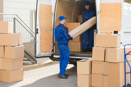 A man with a van handling a local removal in Barnes street setting