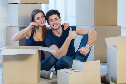 Movers handling furniture safely during a Barnes removals job