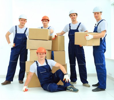 Removal team planning a move in Barnes residential street