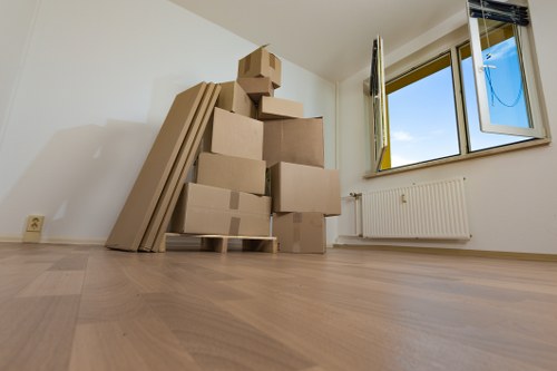 Professional home moving team handling boxes in Barnes