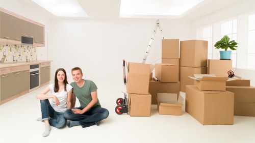 Household furniture being carried through a Barnes home during a move