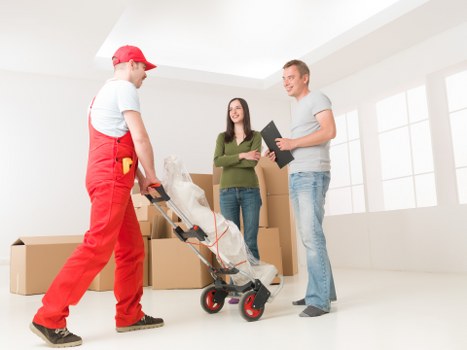 Careful packing and wrapping of household items for relocation