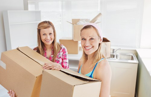 Professional packing supplies and wrapped household items ready for transport